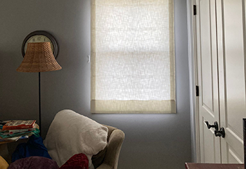 Bedroom in San Jose home featuring custom roller shades on the windows.